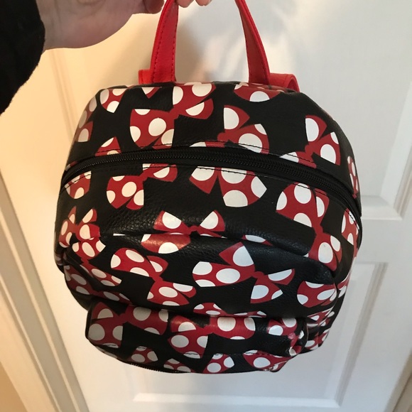 A beautiful Mini Disney Backpack with one packet outside. - Picture 3 of 9